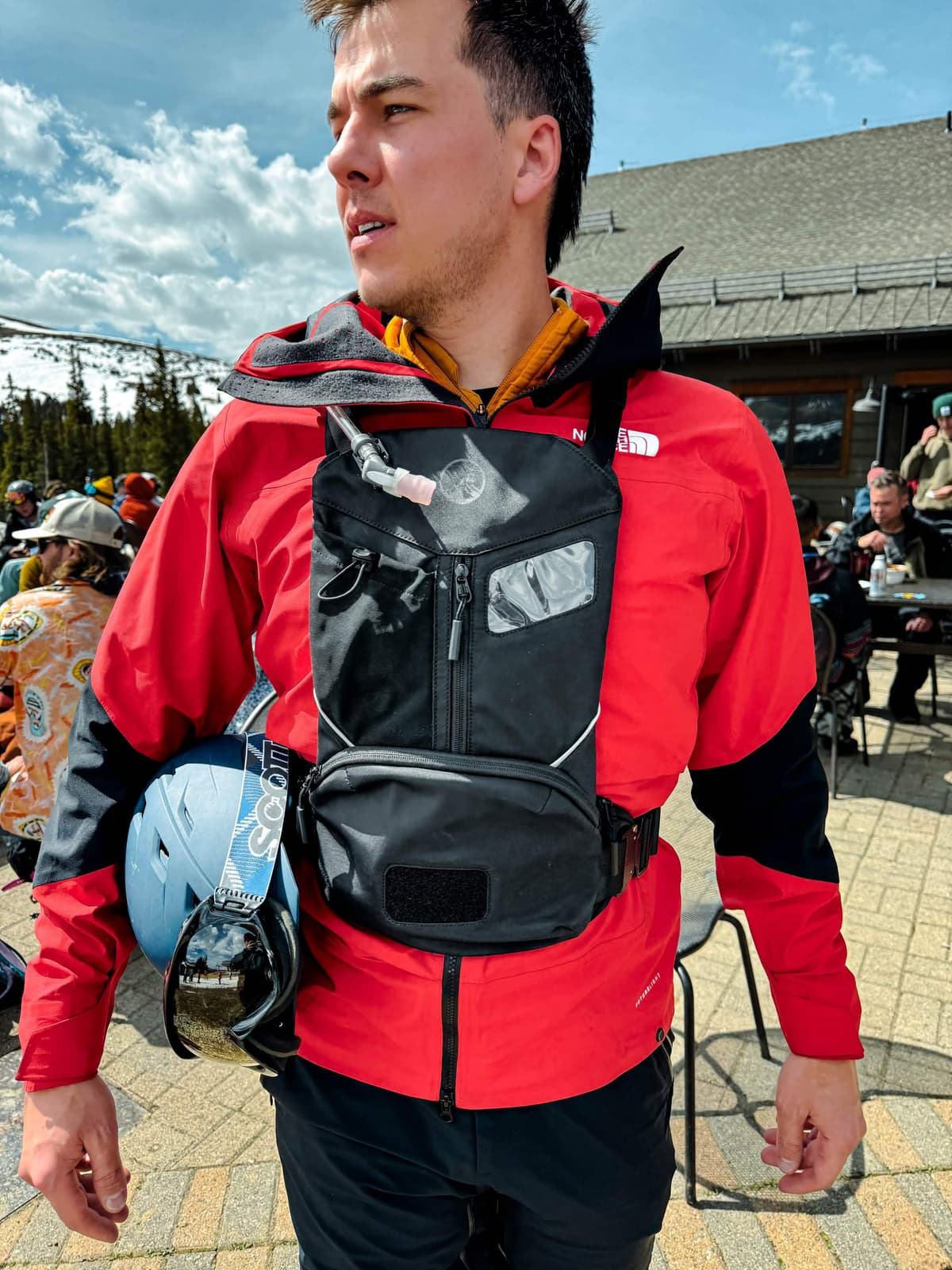 Rider accessing front pocket of CHAIR1 pack